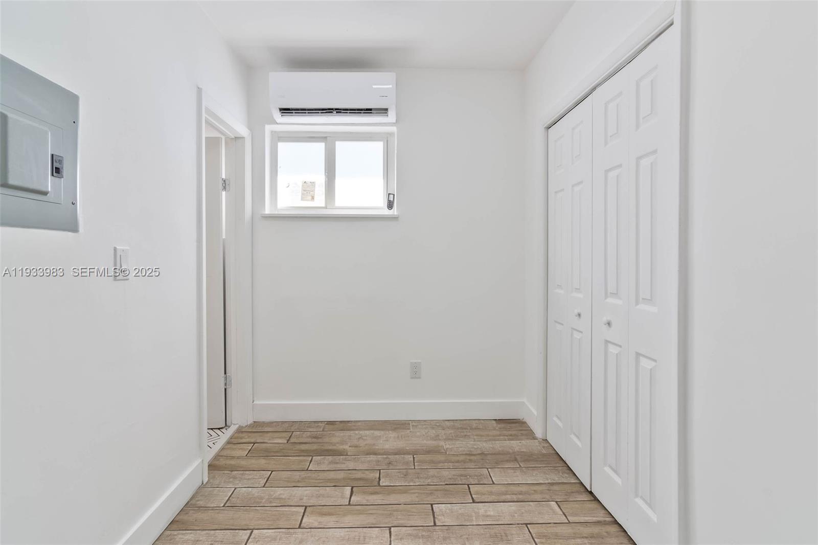 2190 Southwest 14th Terrace, Unit 6 Miami, FL 33145 - Photo 2 of 11 a view of an empty room with windows