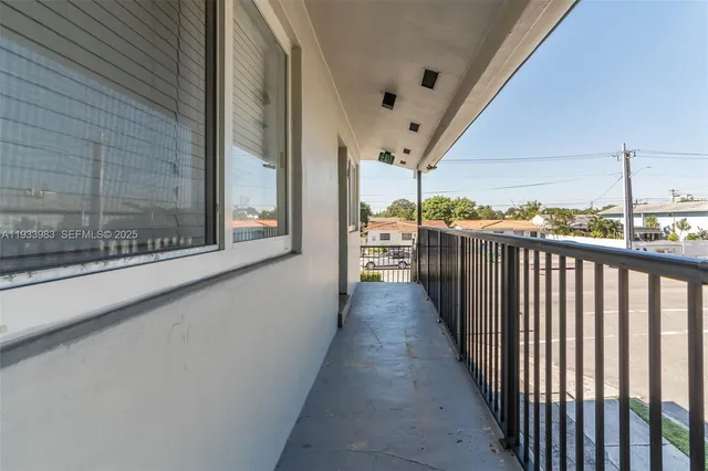 a view of a balcony with wooden floor