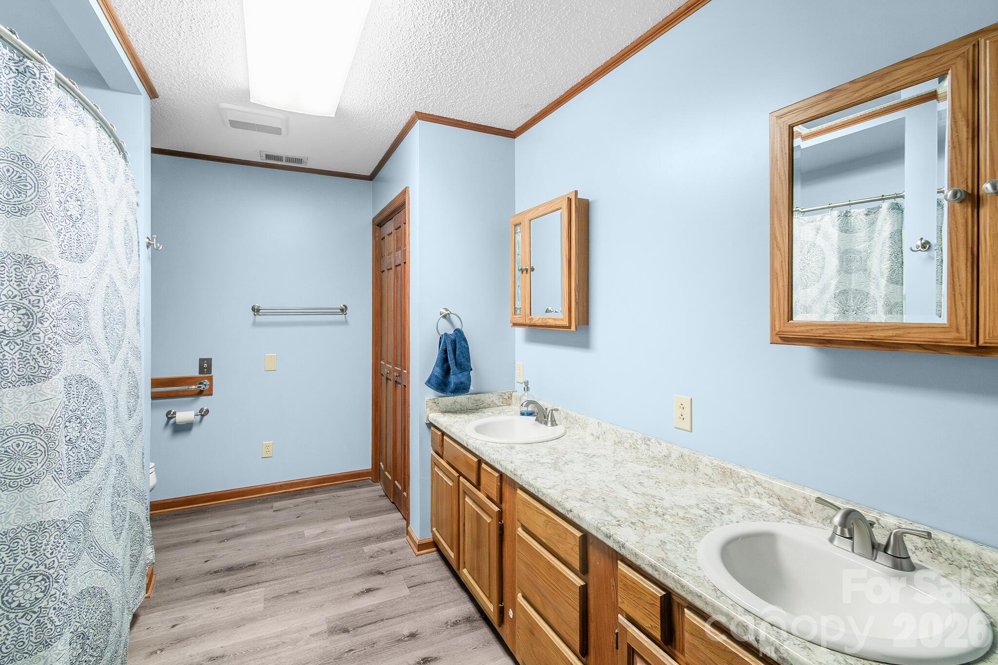 1295 Cattle Ridge Road Cheraw, SC 29520 - Photo 15 of 21 a bathroom with a granite countertop sink and a mirror