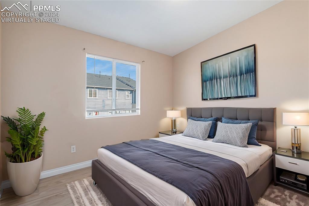 4822 Rusty Nail Point, Unit 201 Colorado Springs, CO 80916 - Photo 23 of 33 a bedroom with bed and window