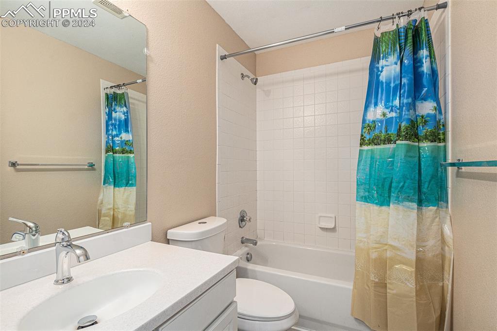 4822 Rusty Nail Point, Unit 201 Colorado Springs, CO 80916 - Photo 26 of 33 a bathroom with a sink toilet and shower
