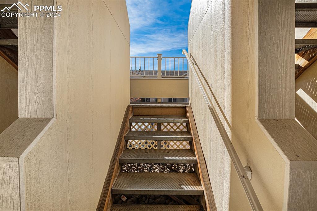 4822 Rusty Nail Point, Unit 201 Colorado Springs, CO 80916 - Photo 32 of 33 a view of a door with wooden floor and a window