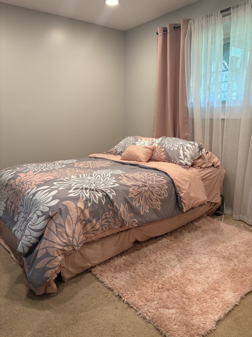 325 Rockhurst Road Bolingbrook, IL 60440 - Photo 12 of 17 a bed sitting in a bedroom next to a window