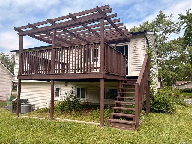 a backyard of a house with barbeque oven