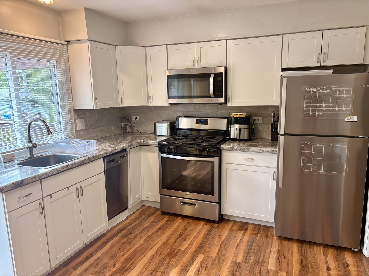 325 Rockhurst Road Bolingbrook, IL 60440 - Photo 5 of 17 a kitchen with a sink stove and microwave