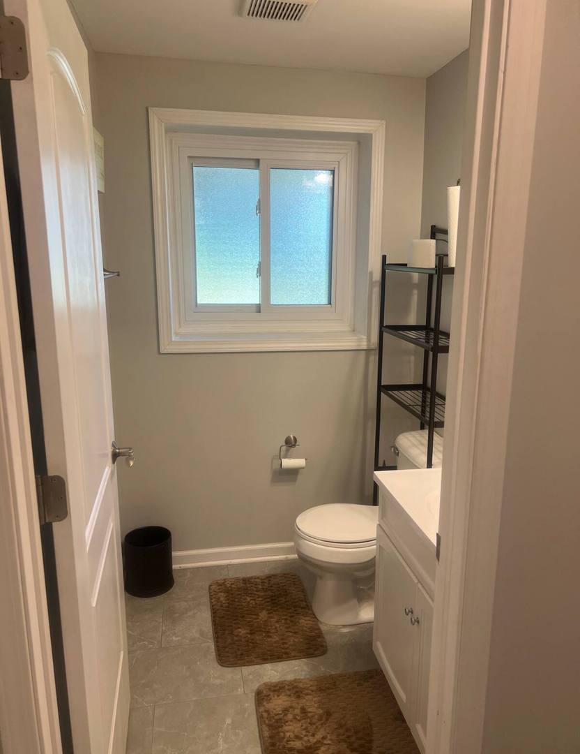 325 Rockhurst Road Bolingbrook, IL 60440 - Photo 9 of 17 a bathroom with a toilet and a shower