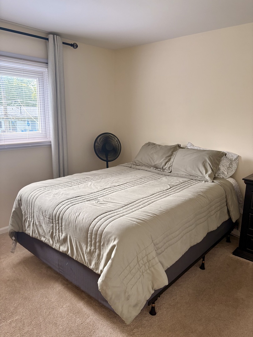 325 Rockhurst Road Bolingbrook, IL 60440 - Photo 10 of 17 a bedroom with a bed and window