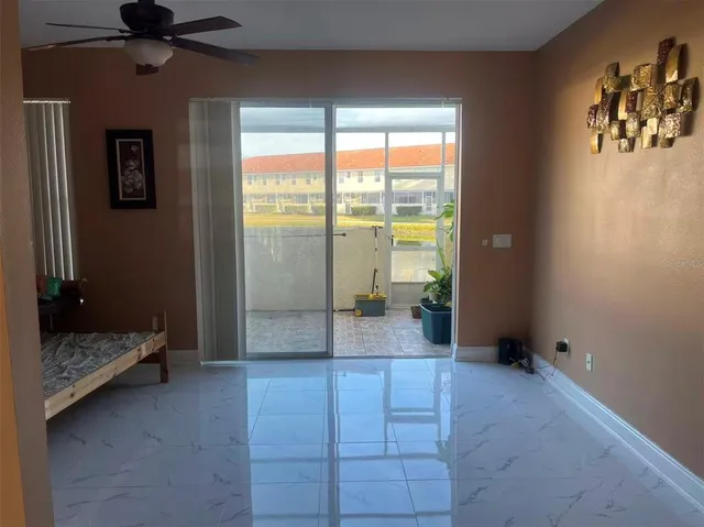 a view of room with window and hardwood floor