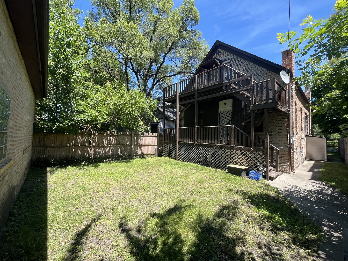 6916 South Lowe Avenue Chicago, IL 60621 - Photo 20 of 22 a view of a house with a yard and sitting area