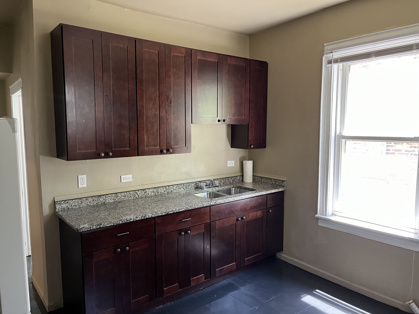 6916 South Lowe Avenue Chicago, IL 60621 - Photo 8 of 22 a kitchen with granite countertop wooden cabinets and a sink