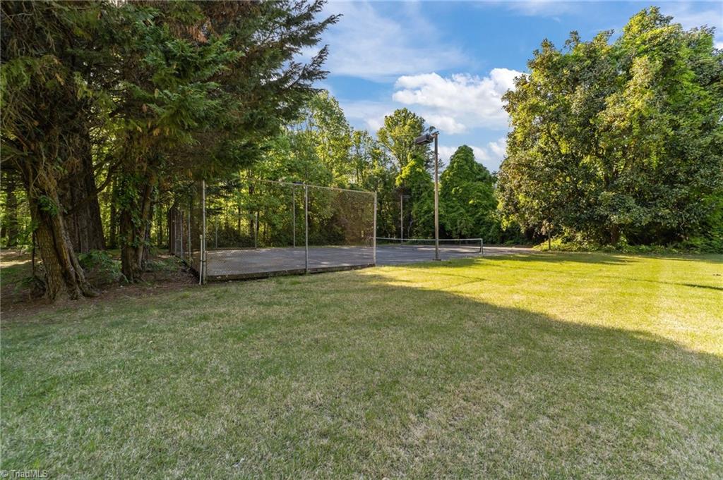 3432 Edgefield Road Greensboro, NC 27409 - Photo 23 of 34 Front yard & tennis ct