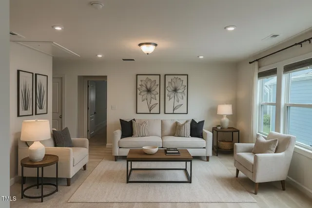 a living room with furniture and a large window