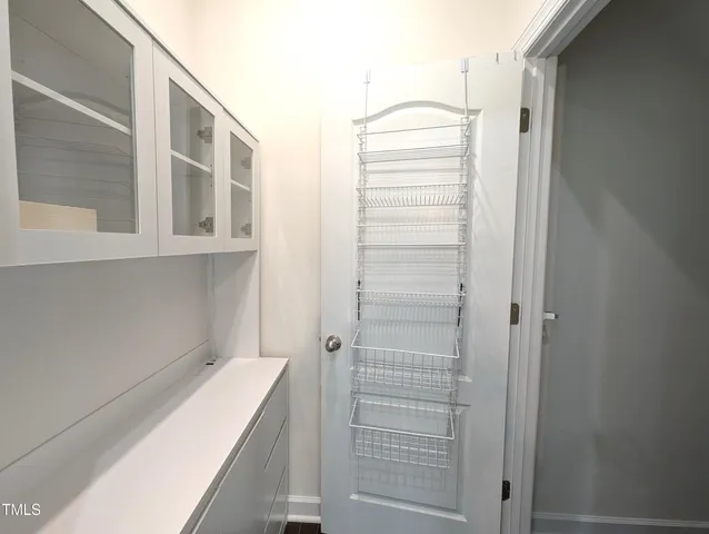 a bathroom with a shower and sink