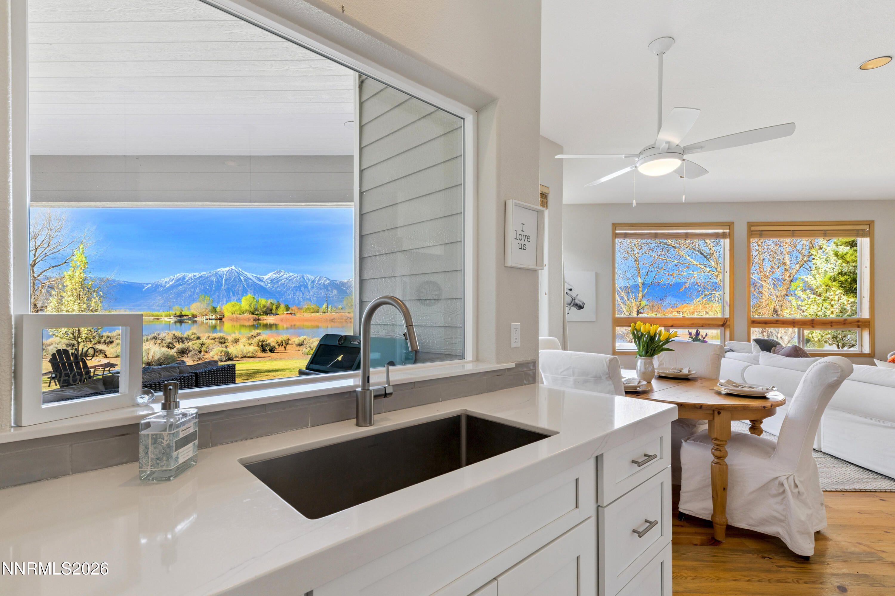 1608 East Valley Road Gardnerville, NV 89410 - Photo 16 of 54 a view of a kitchen with a large window and living room