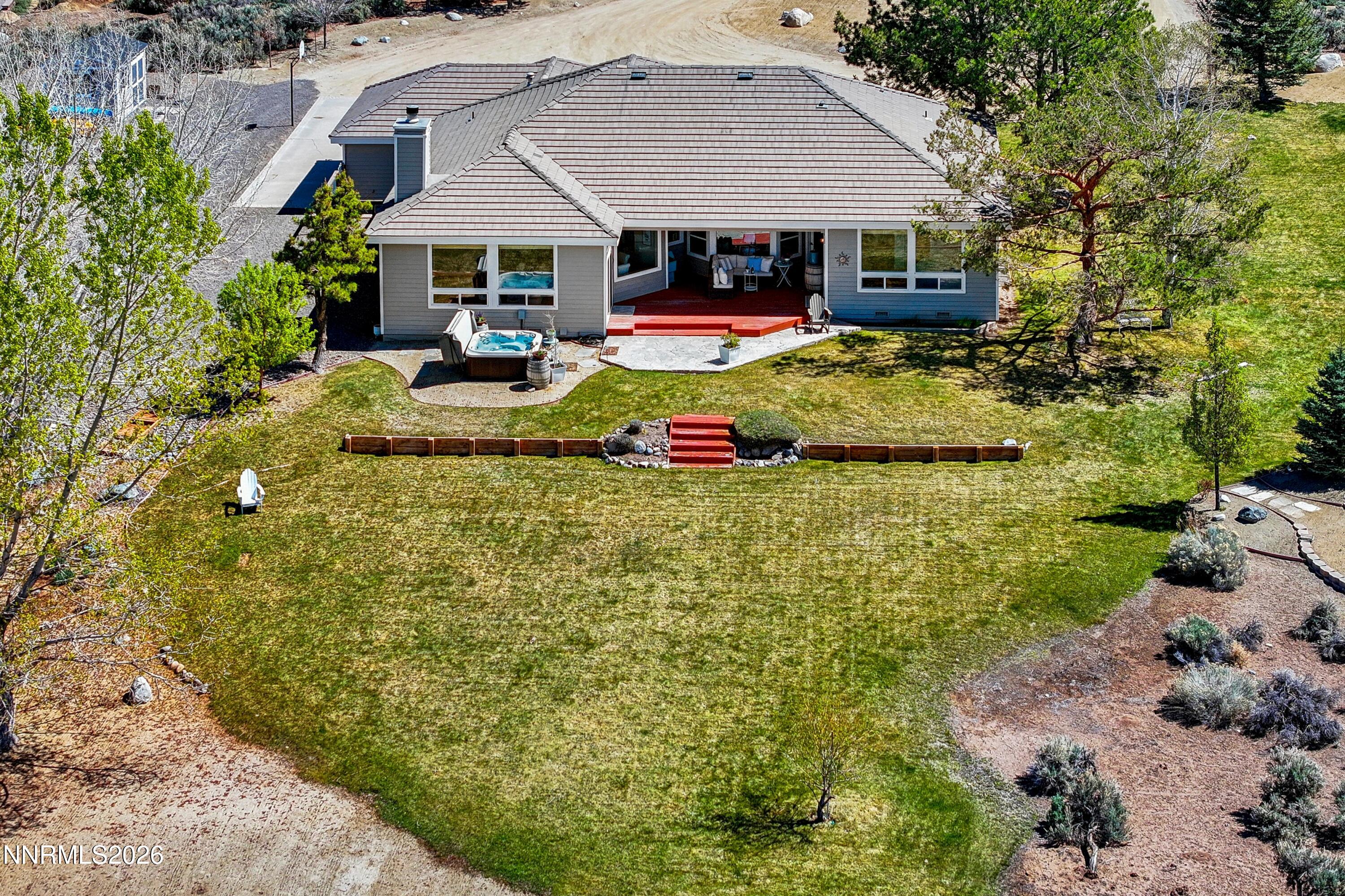 1608 East Valley Road Gardnerville, NV 89410 - Photo 38 of 54 a view of a house with swimming pool and sitting area