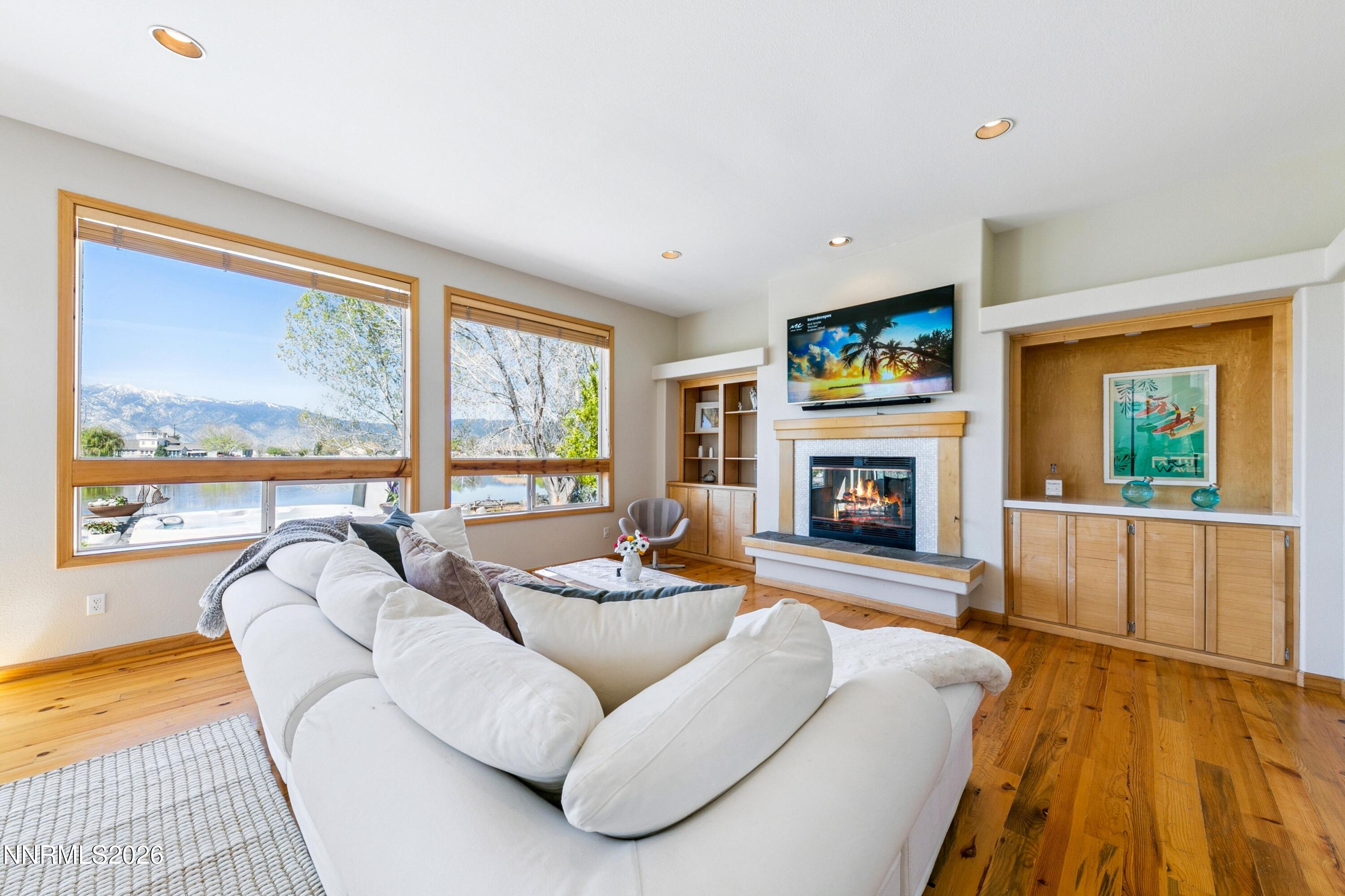 1608 East Valley Road Gardnerville, NV 89410 - Photo 10 of 54 a living room with fireplace furniture and a large window