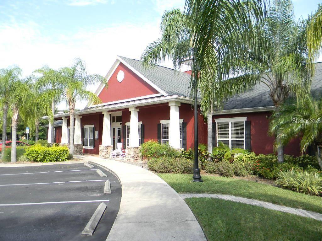 5521 Rosehill Road, Unit 103 Sarasota, FL 34233 - Photo 21 of 24 a front view of a house with a garden