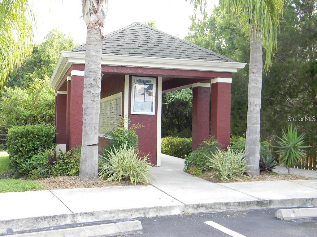 5521 Rosehill Road, Unit 103 Sarasota, FL 34233 - Photo 22 of 24 a front view of a house with garden