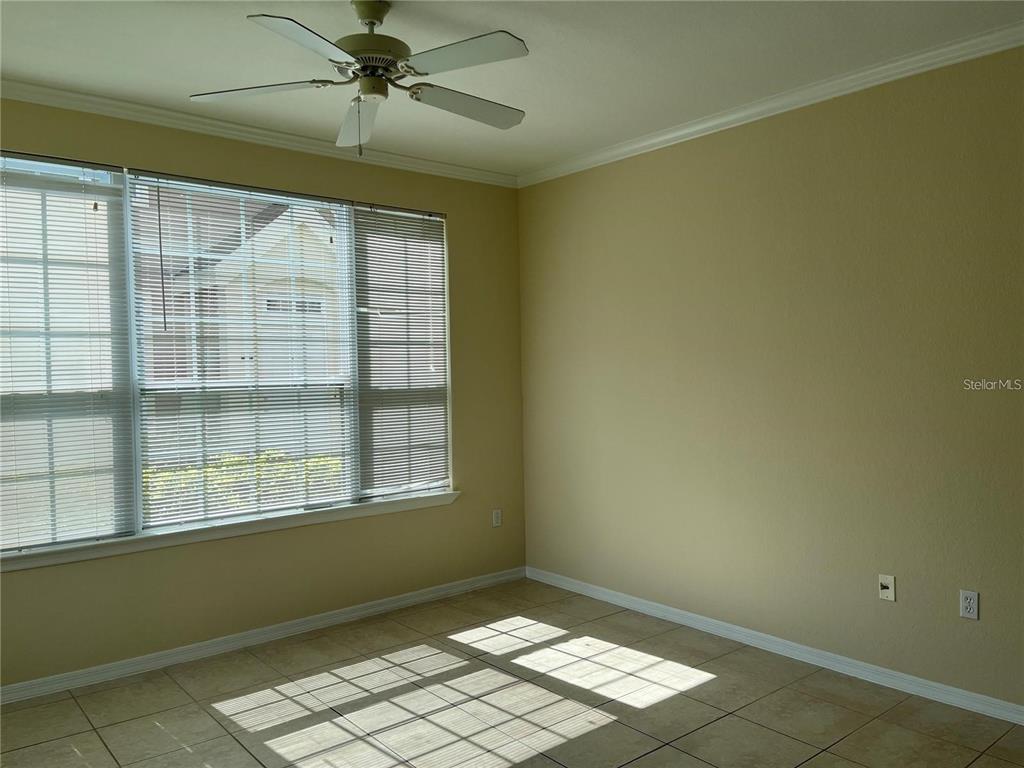 5521 Rosehill Road, Unit 103 Sarasota, FL 34233 - Photo 10 of 24 an empty room with windows