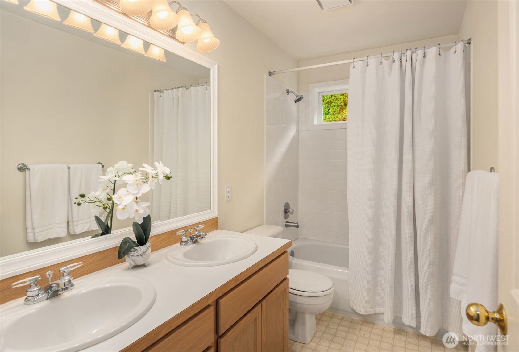 10330 Northeast 151st Place Bothell, WA 98011 - Photo 24 of 38 a bathroom with a granite countertop sink toilet and a mirror