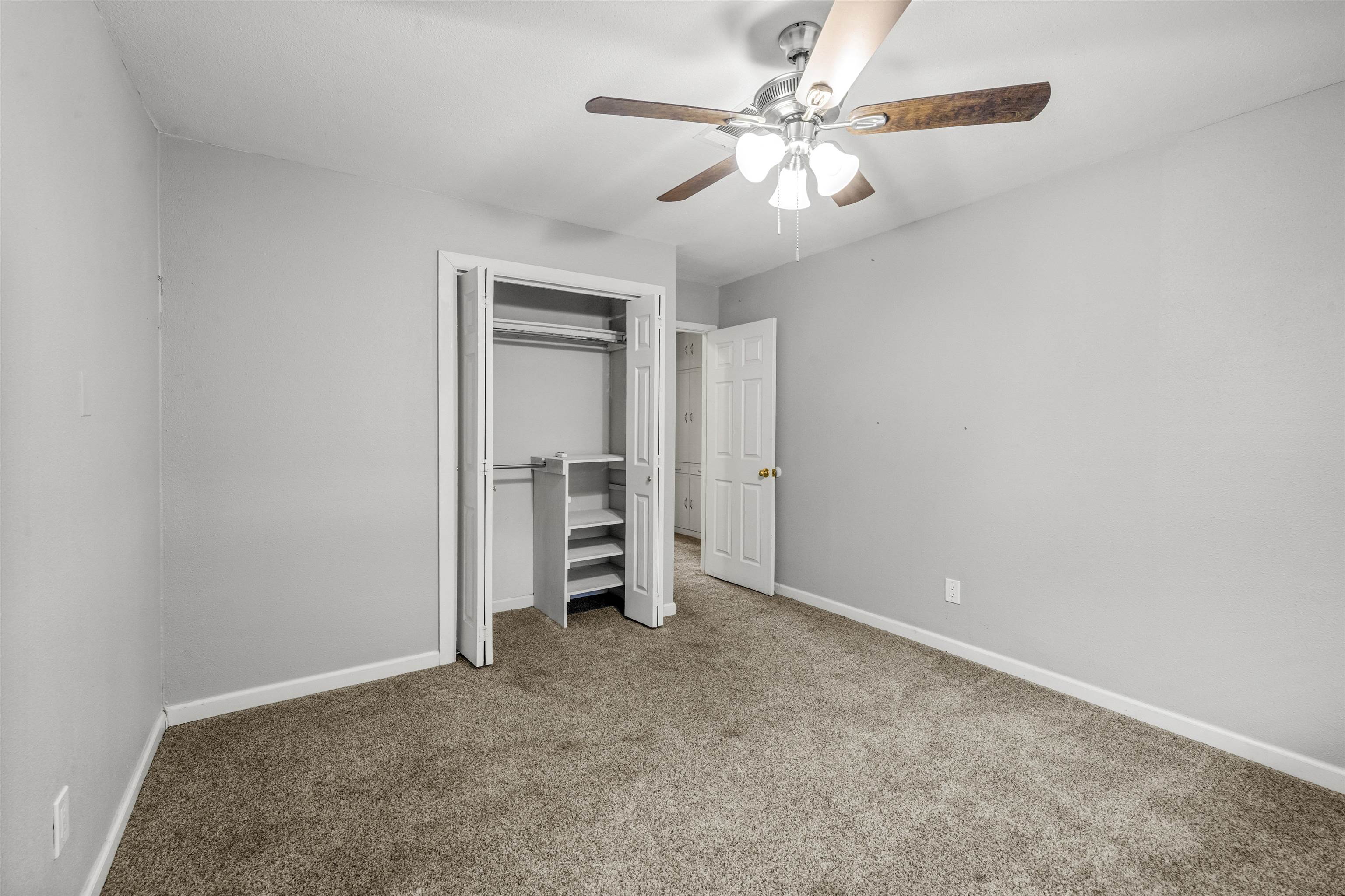 1401 Brazos Street Marble Falls, TX 78654 - Photo 12 of 23 an empty room with closet and fan