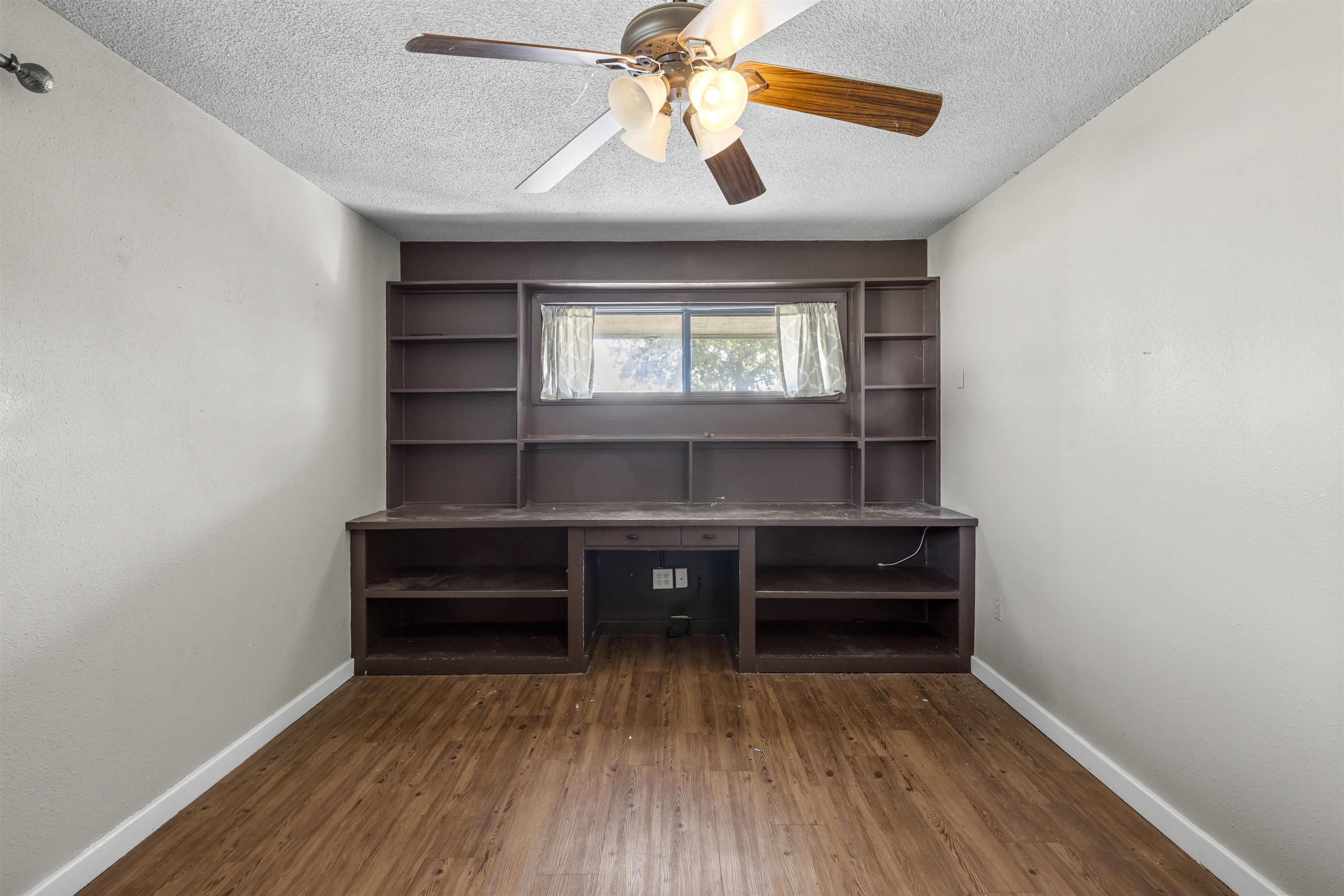 1401 Brazos Street Marble Falls, TX 78654 - Photo 15 of 23 a living room with a piano and a window