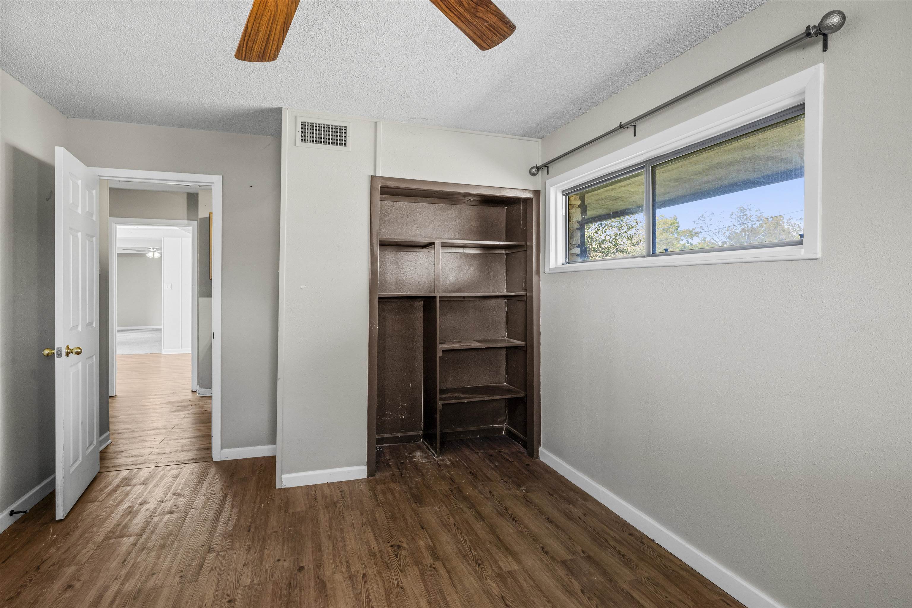 1401 Brazos Street Marble Falls, TX 78654 - Photo 16 of 23 a view of empty room with wooden floor