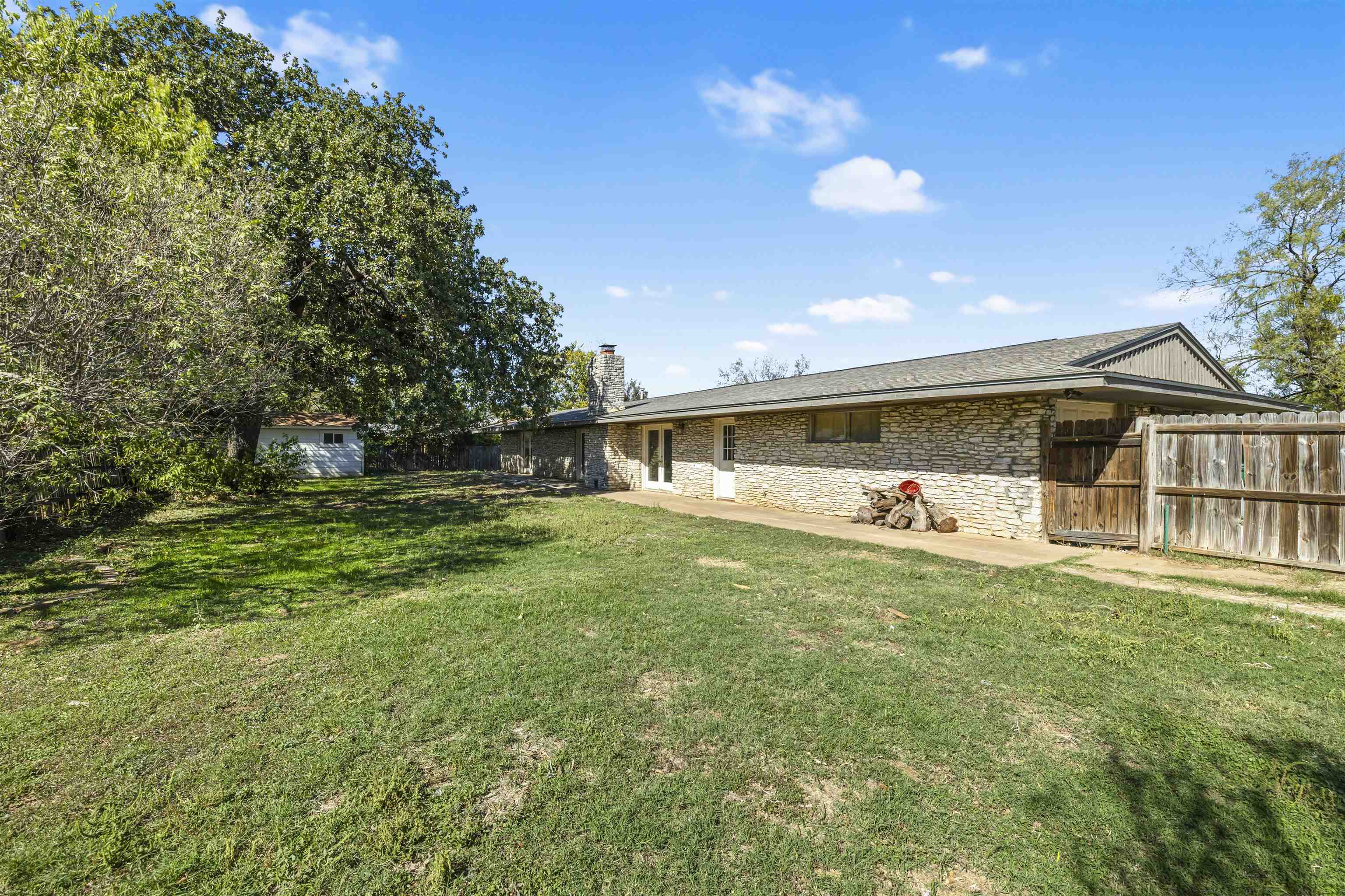 1401 Brazos Street Marble Falls, TX 78654 - Photo 2 of 23 a front view of a house with a yard and lake view