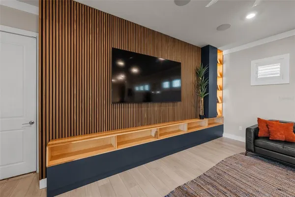 a large kitchen with stainless steel appliances lots of counter space and furniture