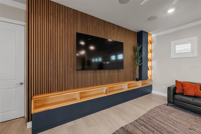 a large kitchen with stainless steel appliances lots of counter space and furniture