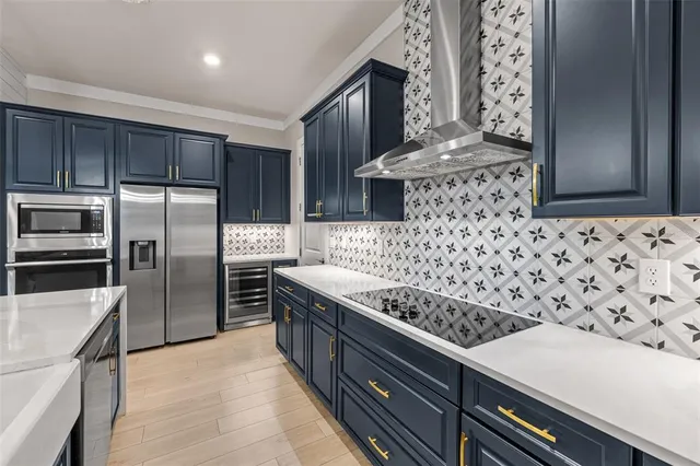 a large kitchen with kitchen island a sink and a stove top oven