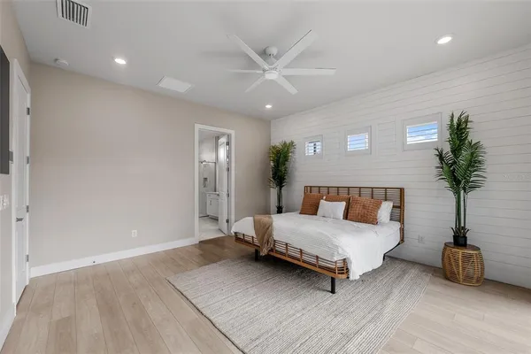 a bathroom with a shower sink and mirror