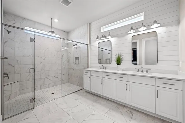 a bathroom with a sink a mirror and a toilet