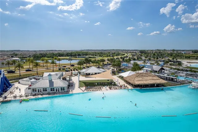 a view of a swimming pool and outdoor seating
