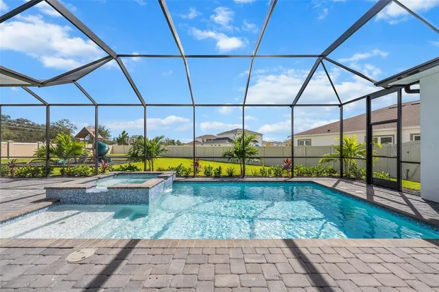 a view of a swimming pool with a porch