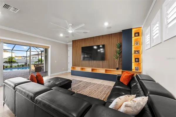 a view of a livingroom with furniture and a flat screen tv