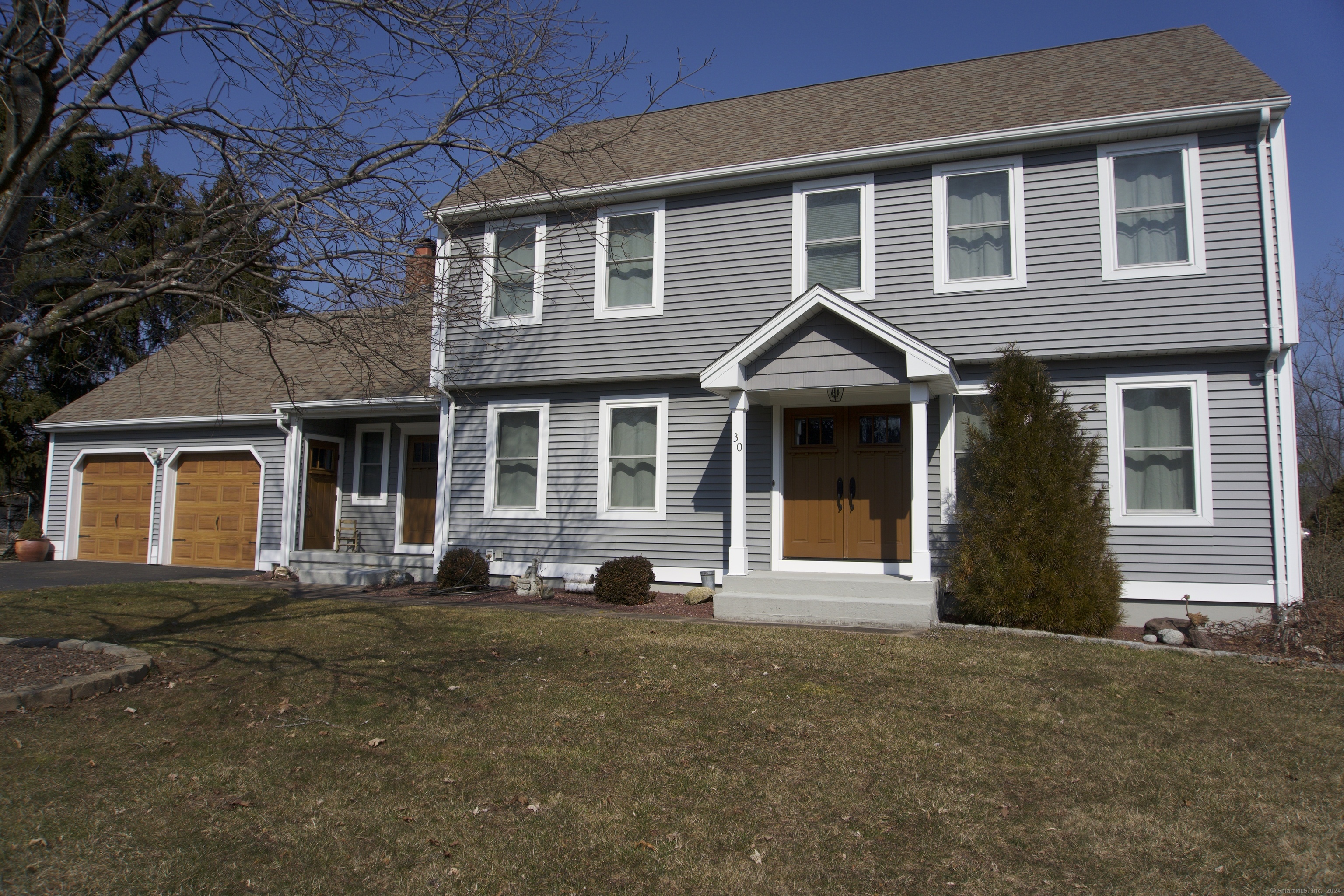 a front view of a house with a yard