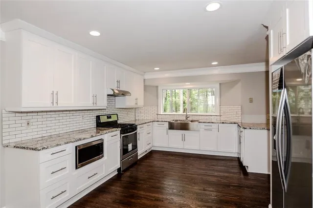 a bathroom with a sink and a window