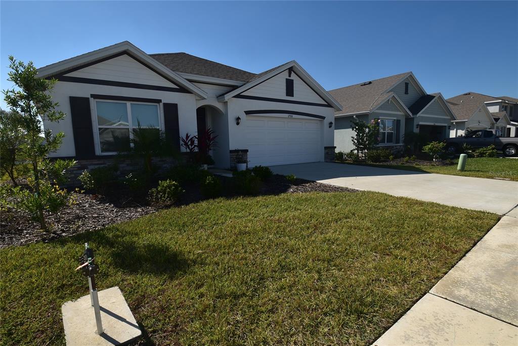 17918 Canopy Place Bradenton, FL 34211 - Photo 1 of 15 a front view of a house with a yard