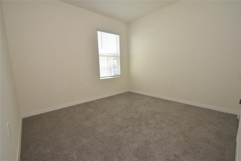 17918 Canopy Place Bradenton, FL 34211 - Photo 13 of 15 an empty room with a window