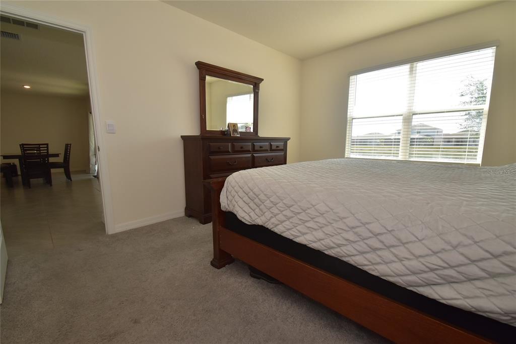 17918 Canopy Place Bradenton, FL 34211 - Photo 7 of 15 a bed sitting in a bedroom next to a window