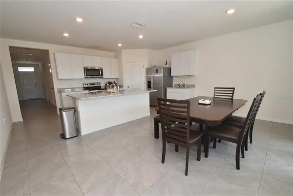 a view of a dining room with furniture