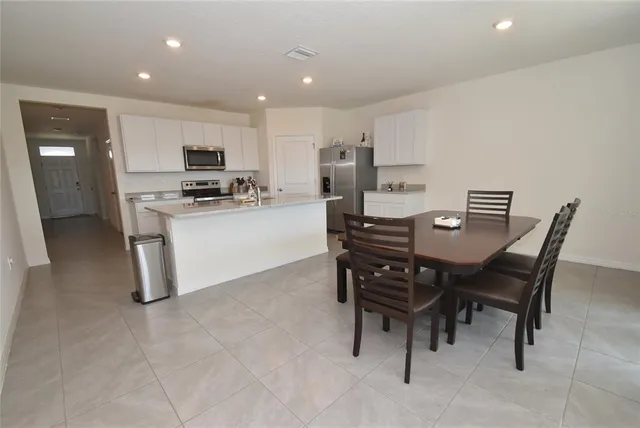 a view of a dining room with furniture