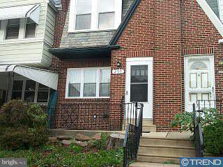 257 Sanford Road Upper Darby, PA 19082 - Photo 1 of 1 a view of brick house with large windows