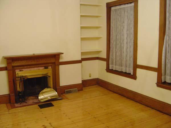 9 Symphony Road Boston, MA 02115 - Photo 4 of 9 a living room with a fireplace furniture and a window