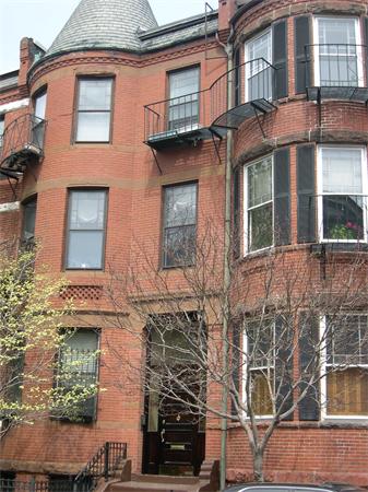 9 Symphony Road Boston, MA 02115 - Photo 5 of 9 front view of a brick house with a large windows