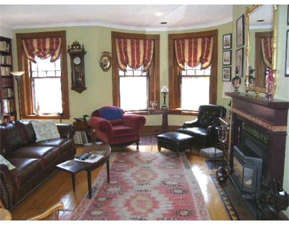 9 Symphony Road Boston, MA 02115 - Photo 9 of 9 a living room with furniture and a window
