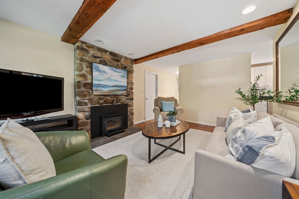 1563 Bay Road Sharon, MA 02067 - Photo 14 of 41 a living room with furniture and a flat screen tv