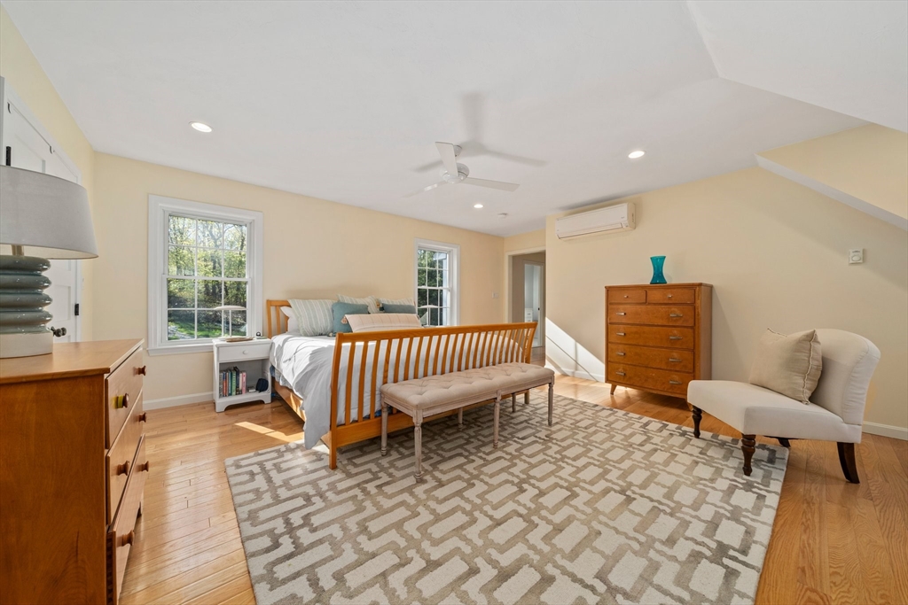 1563 Bay Road Sharon, MA 02067 - Photo 19 of 41 a living room with furniture a rug and a window