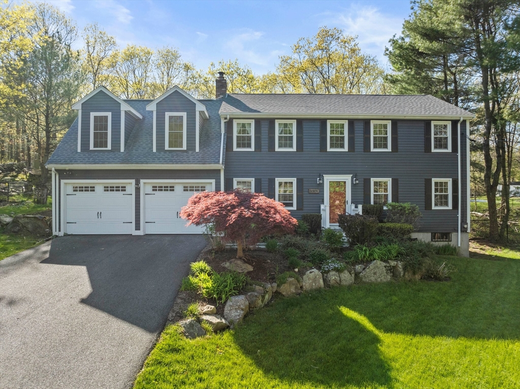 1563 Bay Road Sharon, MA 02067 - Photo 2 of 41 a front view of a house with garden